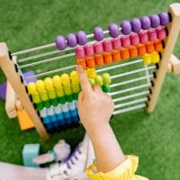 Child playing with an abacus and learning to count