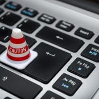 White caution cone on keyboard